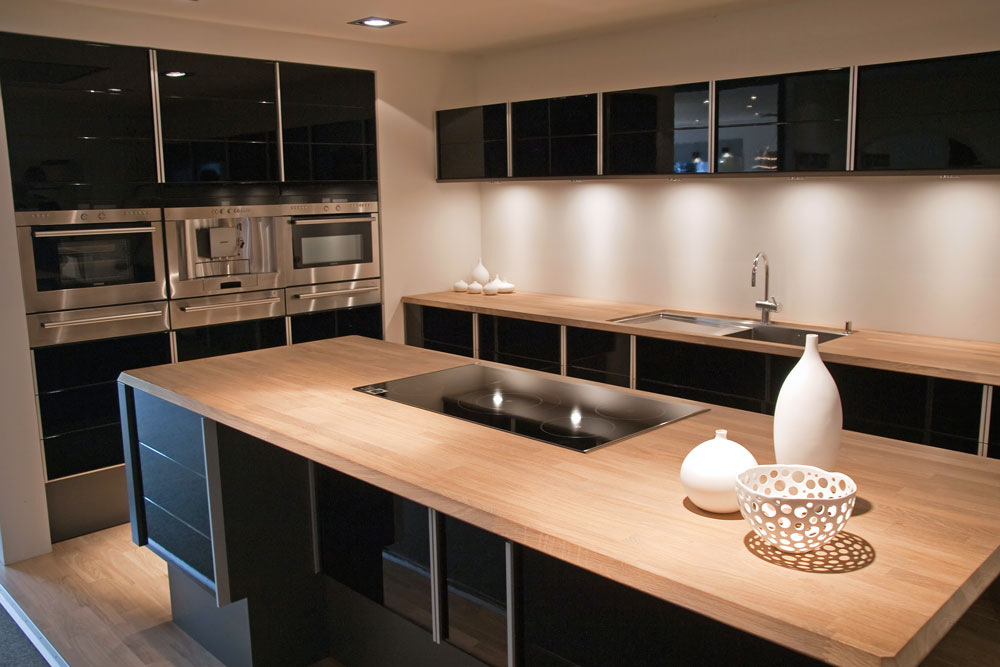 modern kitchen with black and timber laminate cabinetry