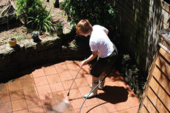 Woman cleaning brick pavement, clean brick pavement, Handyman Magazine, DIY,