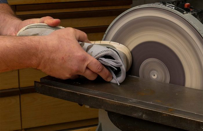 Use a sneaker to clean sandpaper