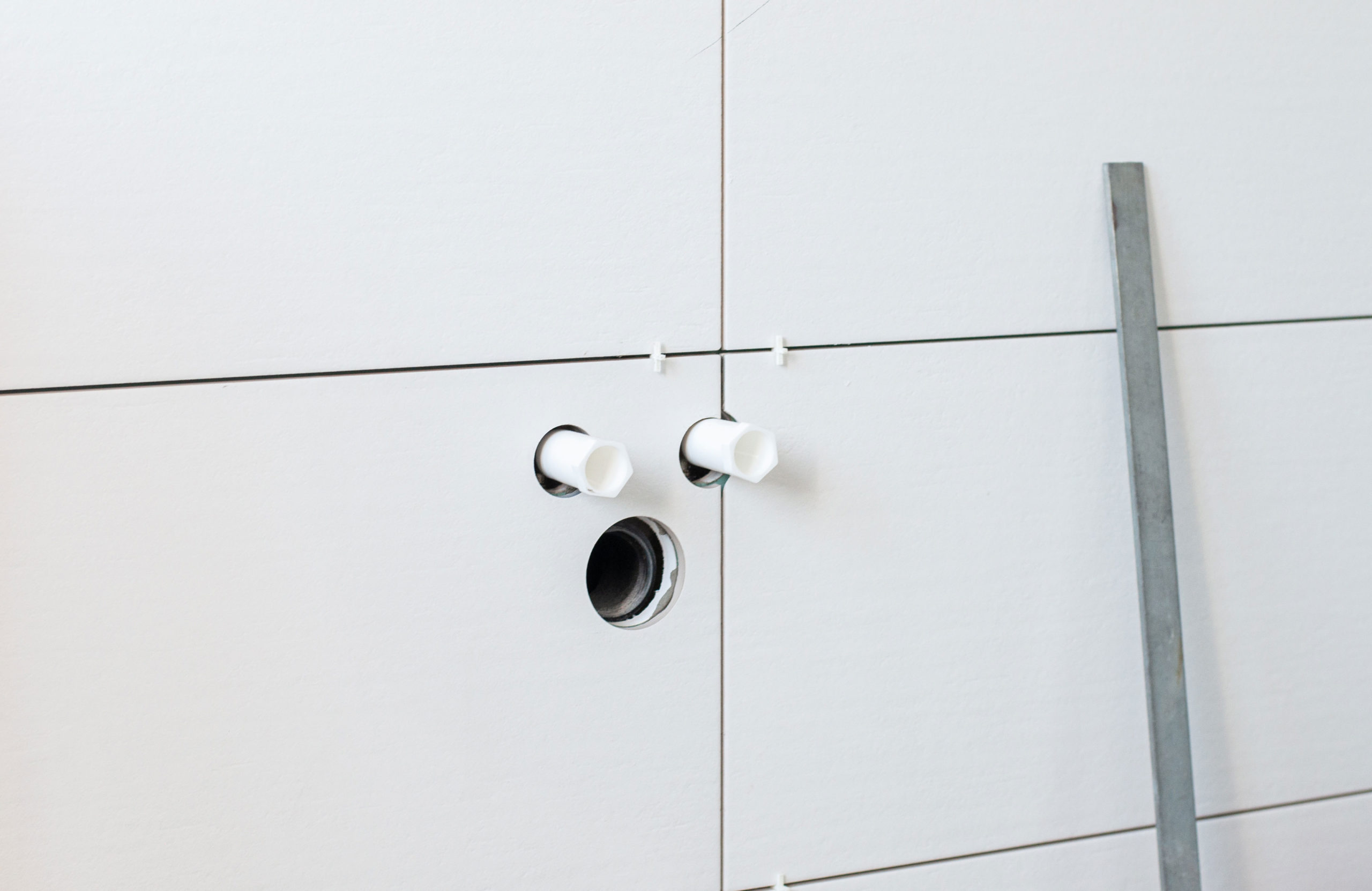 Neat holes for pipes