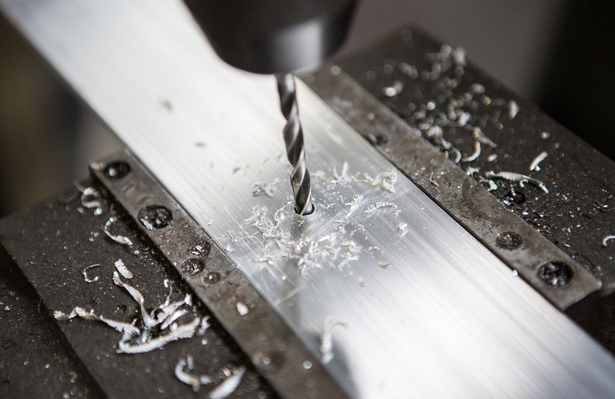 Drilling small holes in wood or metal